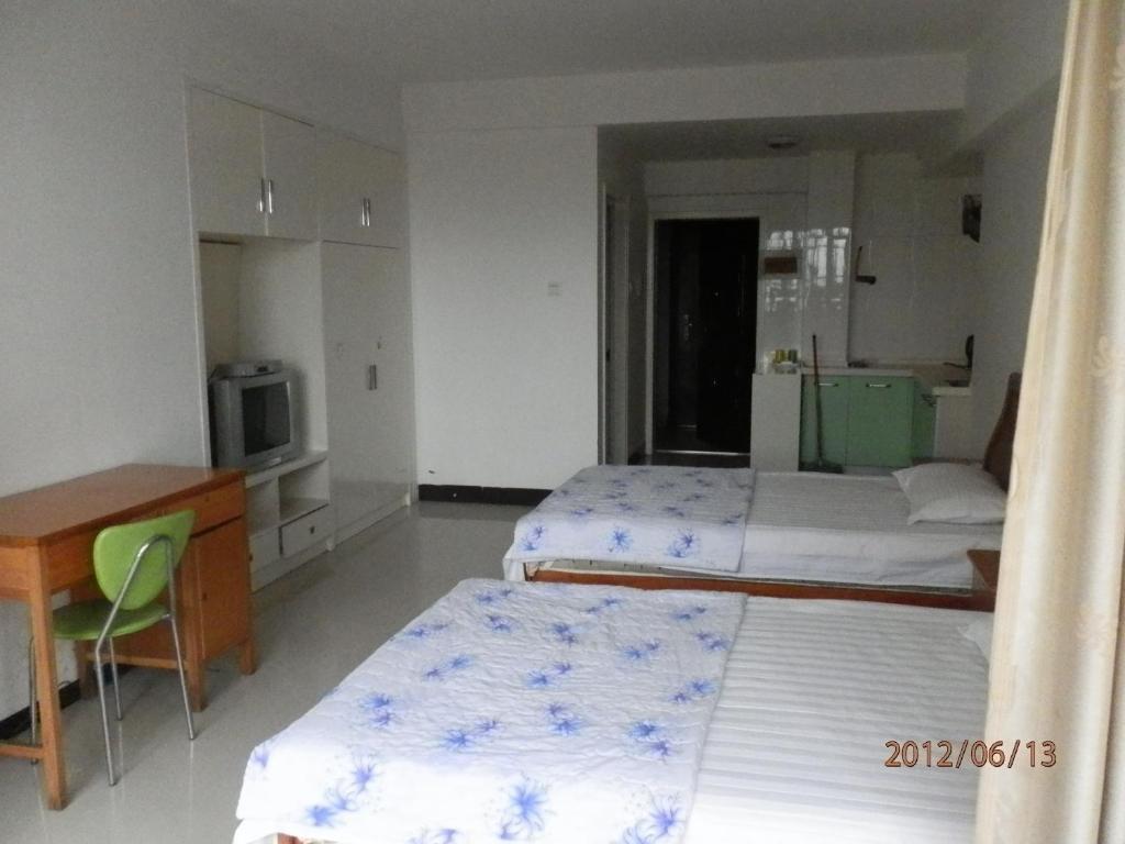 Xingfu Hotel Nanning Szoba fotó